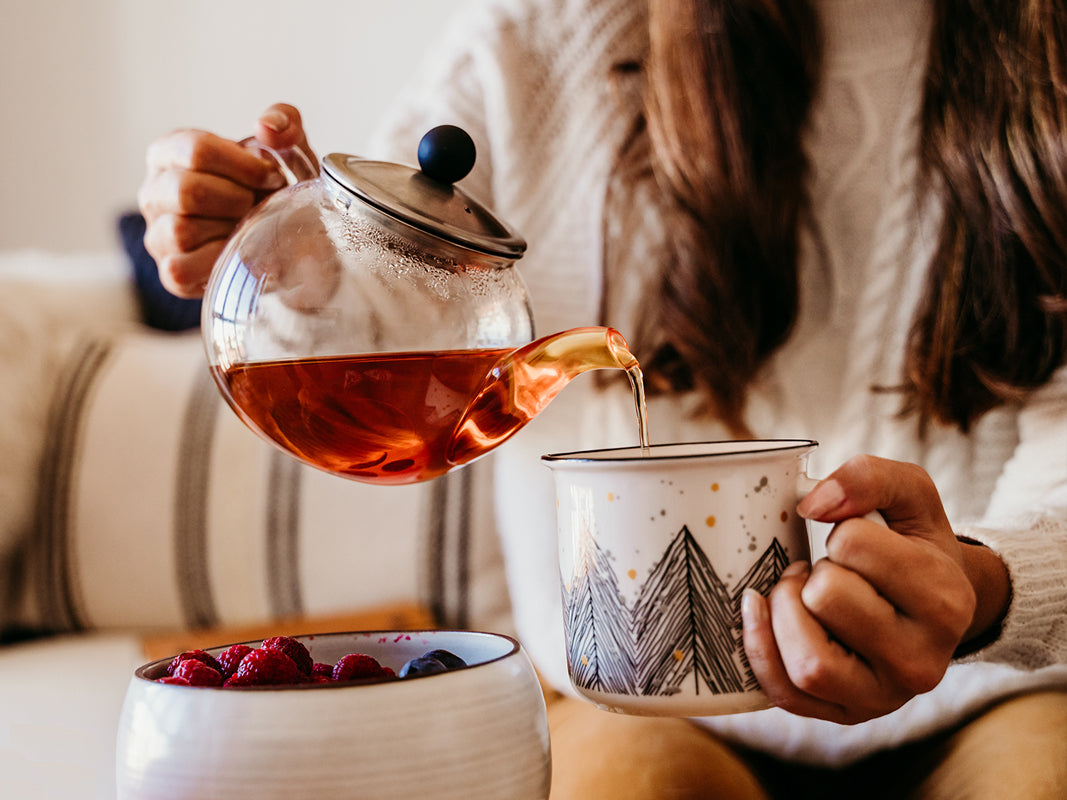 Woman pouring Rhodiola rosea tea