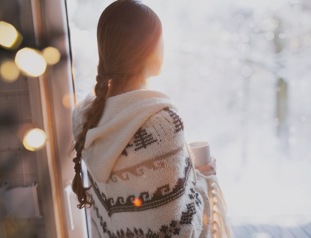 Calm woman reflecting and drinking rhodiola tea